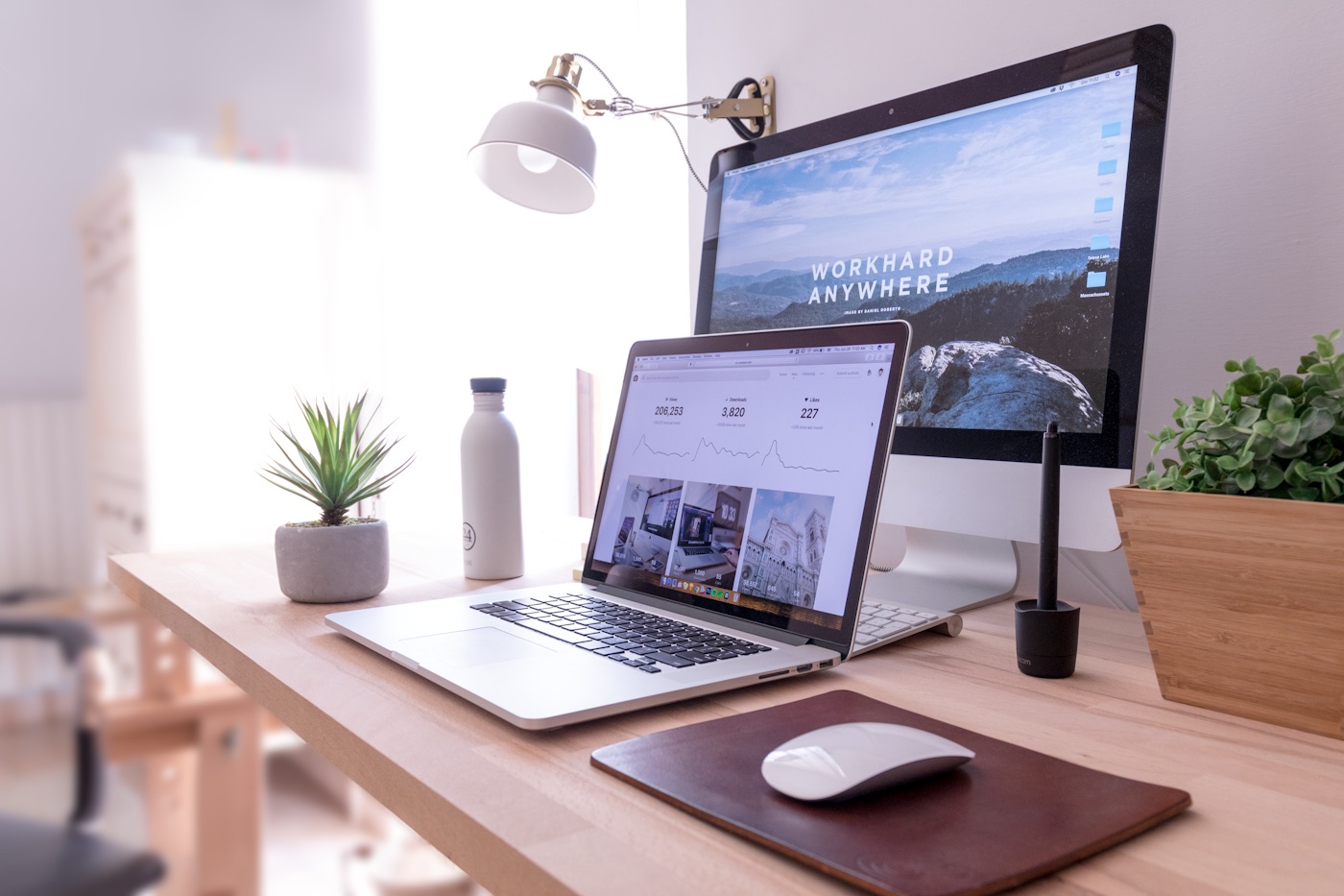 A clean modern laptop on a desk showing a web browser — a service site built around a single measurable job
